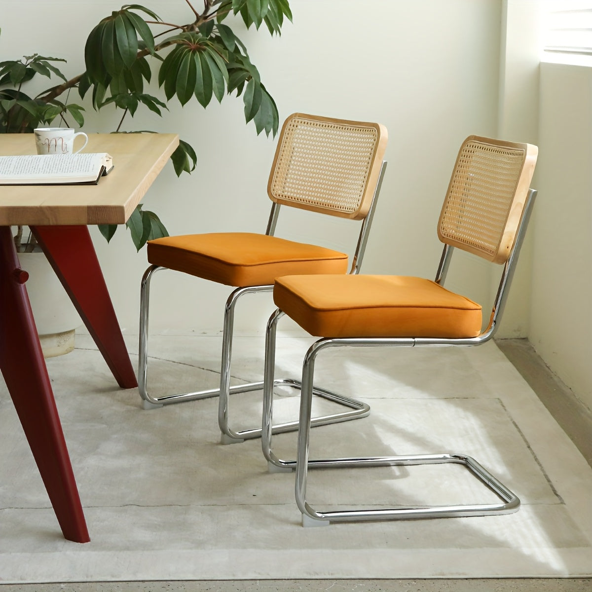 Set of Two Dining Chairs Featuring Velvet And Rattan, Designed with Chrome Legs. These Modern Mid-Century Breuer-Style Chairs Are Upholstered And Suitable for Dining, Living Rooms, Or Kitchens